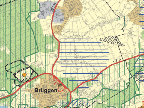 Kartenauszug Gemeindegebiet mit verschieden großen, farbigen Flächen zur Ausweisung der Raumnutzung, unten links Beschriftung "Brüggen", rote Linien für Bundes- und Landesstraßen, blaue und grüne Linien im Bild, alle Beschriftungen in schwarz oder hellgrau